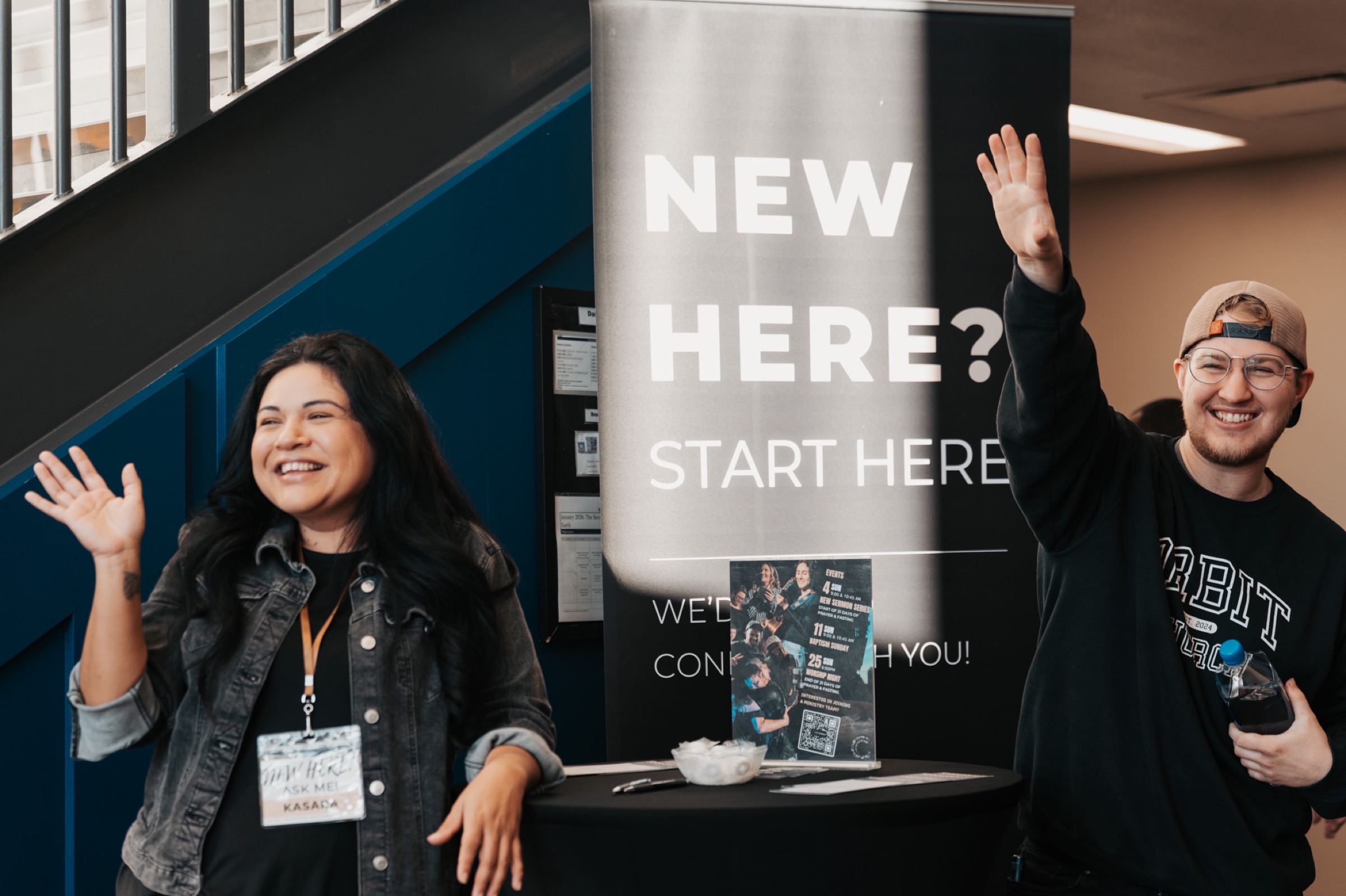 Orbit volunteers welcoming people at church