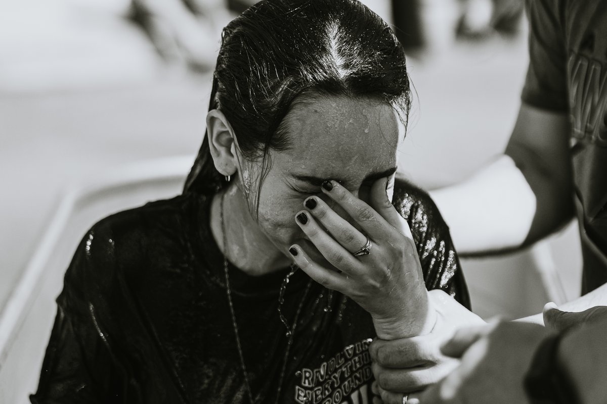 A woman moved to tears just after her baptism at Orbit Church