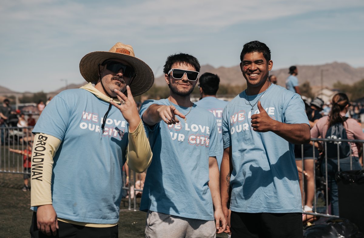 Orbit volunteers in We Love Our City shirts at a community event