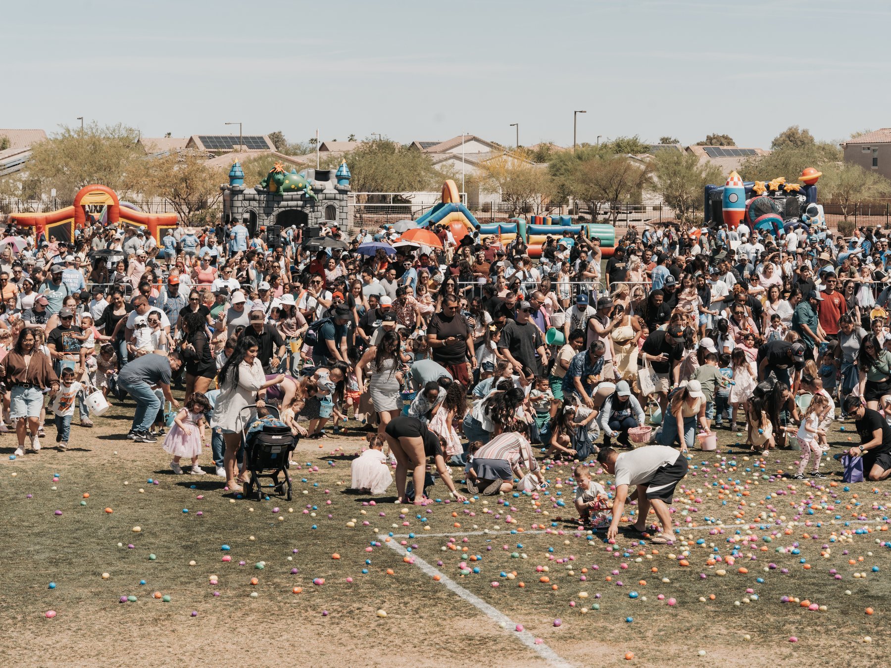 Hundreds of neighbors gathered on the field for Orbit's community egg hunt